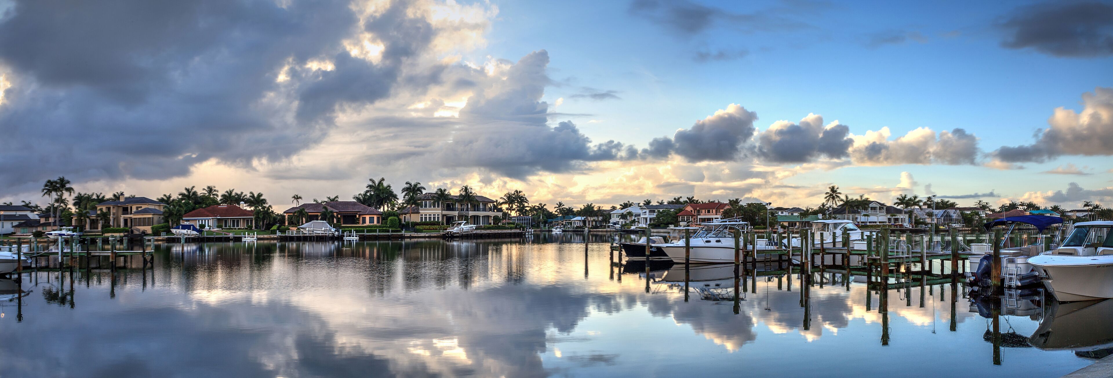 Boats docked at a Marina near Venetian Bay in Naples, Florida