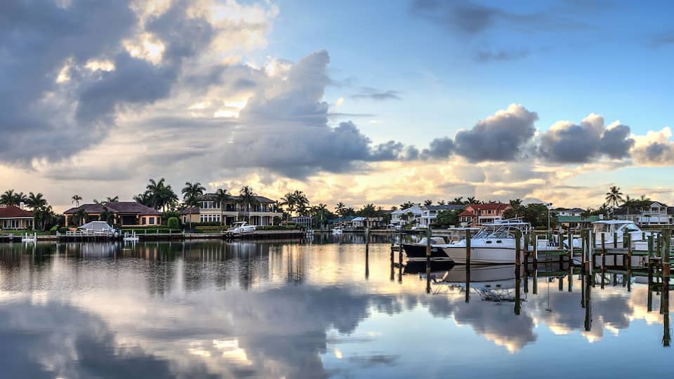 Boats docked at a Marina near Venetian Bay in Naples, Florida
