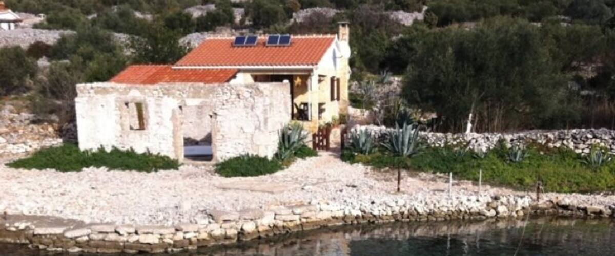 Stone house for living on island of Pasman...