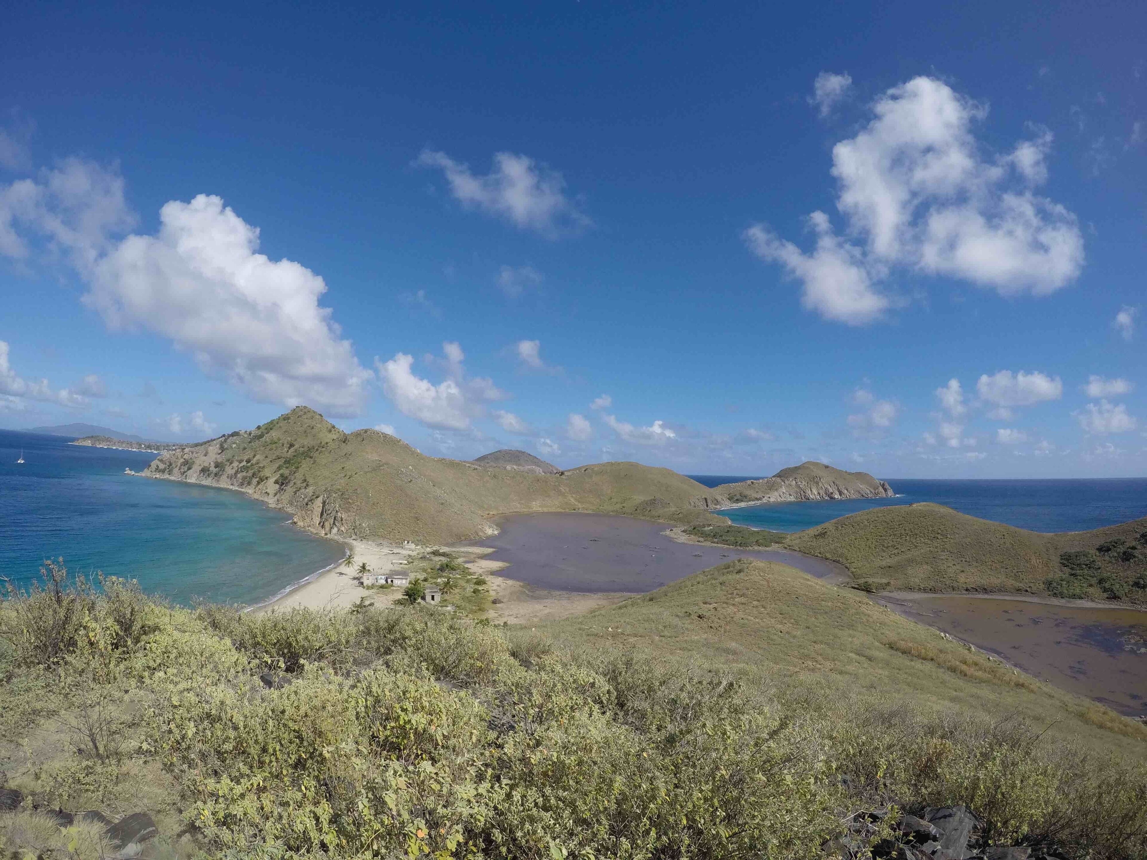 This is pretty much the entire island. Two super salty (I’m guessing) lakes and some abandoned buildings on the left.  The lakes should be white with salt. I don't know why they are brown now.

Just off to the bottom right (off screen) is where the HMS Rhone sank.  Salt Island and the HMS Rhone are forever connected because of what the family did and didn't do to the wreck.  For their actions the Queen of England gave them the island.