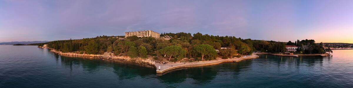 Aerial view of Haludovo resort with tranquil sea, coastline, and lush trees, Malinska-Dubasnica, Primorje-Gorski Kotar, Croatia.