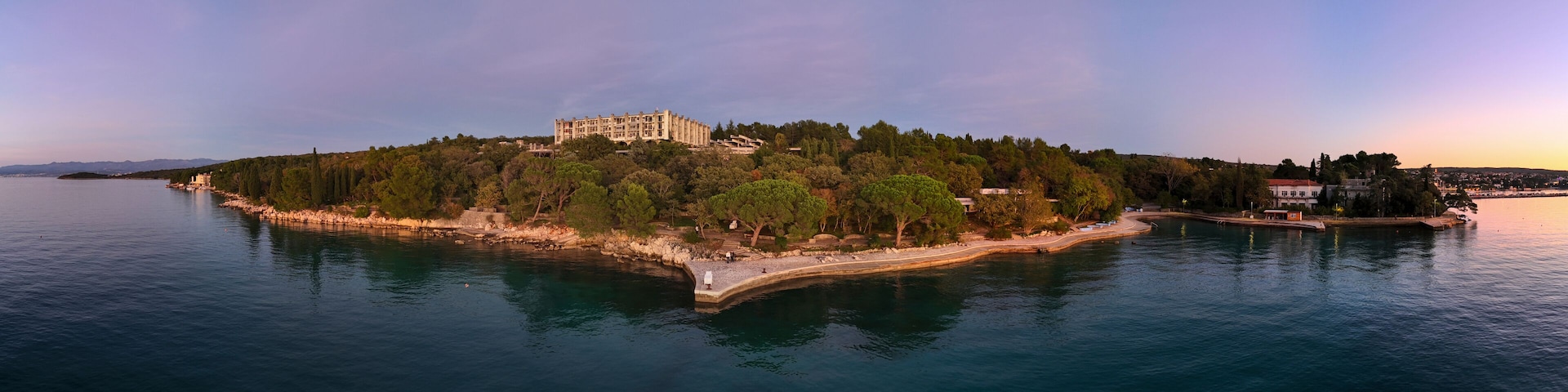 Aerial view of Haludovo resort with tranquil sea, coastline, and lush trees, Malinska-Dubasnica, Primorje-Gorski Kotar, Croatia.
