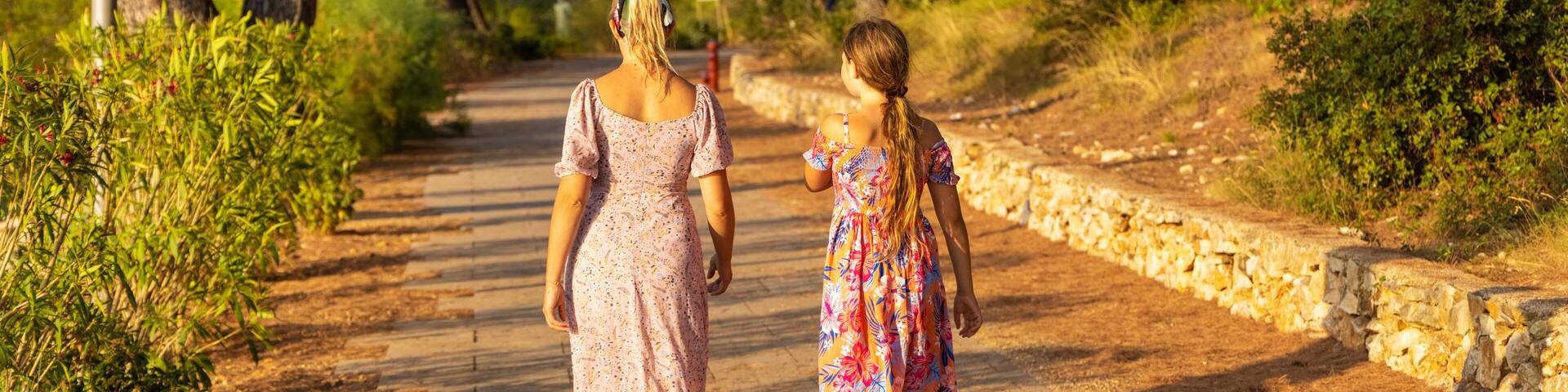Mother and daughter are walking on the path, Mali Losinj, Croatia