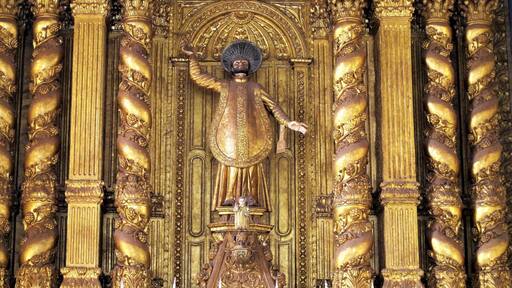 The altar inside the Basilica of Bom Jesus has statues of St. Francis Xavier and the Infant Jesus.
Built at the end of the 16th century, the Basilica of Bom Jesus meaning Good or Infant Jesus is a UNESCO world heritage site. It holds the mortal remains of St. Francis Xavier, who went to India from Portugal to preach the gospel and do missionary work in Goa and other Portuguese provinces in India at the time. #Details