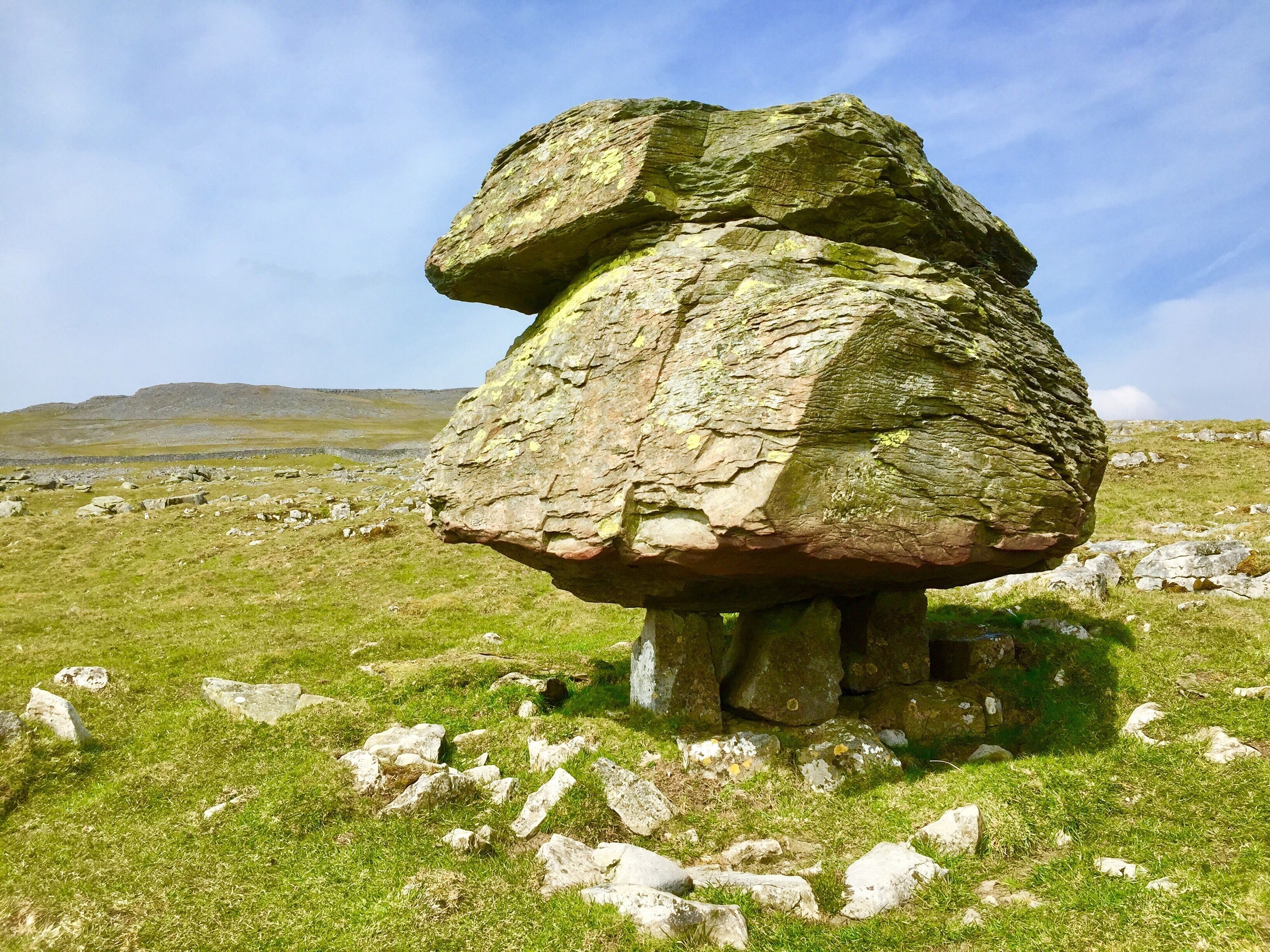 The Norber erratics are the  finest example of glacial erratic boulders in Britain. Huge lumps of gritstone have been deposited onto the limestone bedrock, many balanced on limestone plinths. The boulders were left by retreating glaciers at the end of the last Ice Age, 12,000 years ago.