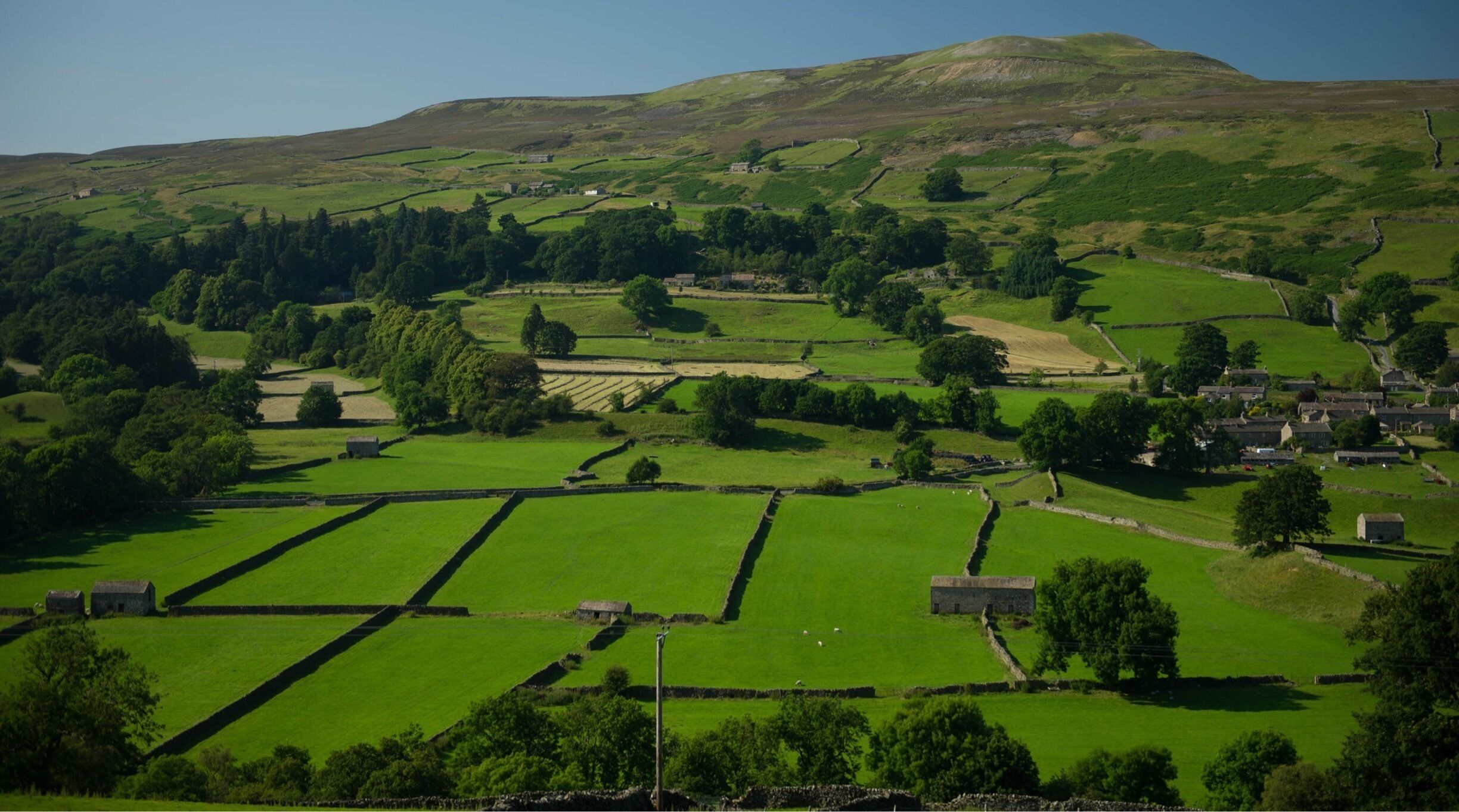 Arguably the most beautiful of all the Dales, Swaledale straddles the River Swale in North Yorkshire . This photo was taken on Low Row Rd. just prior to High Row Rd. before it intersects with Cross Top Rd which runs down into Askrigg. 