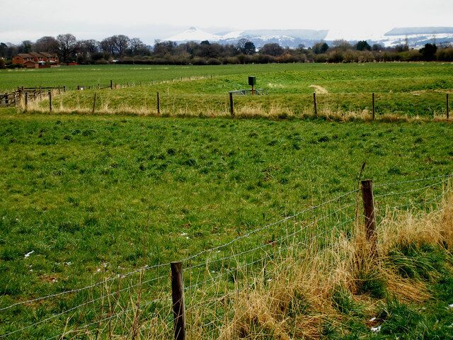 Fenced off flood levees at the side of the Leven