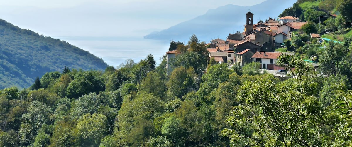 The Swiss mountain village of Rasa Ti in Ticino, surrounded by dense forests on Lake Lugano