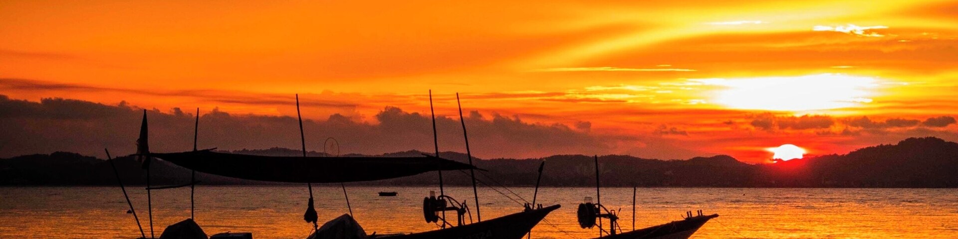 Sunset view from Kapas Island with two fishing boats anchored in the foreground. Colourful sunsets are not often seen here because of the usual thunder storms over the mainland.
#BestOf5
#beach
#GoldenHour