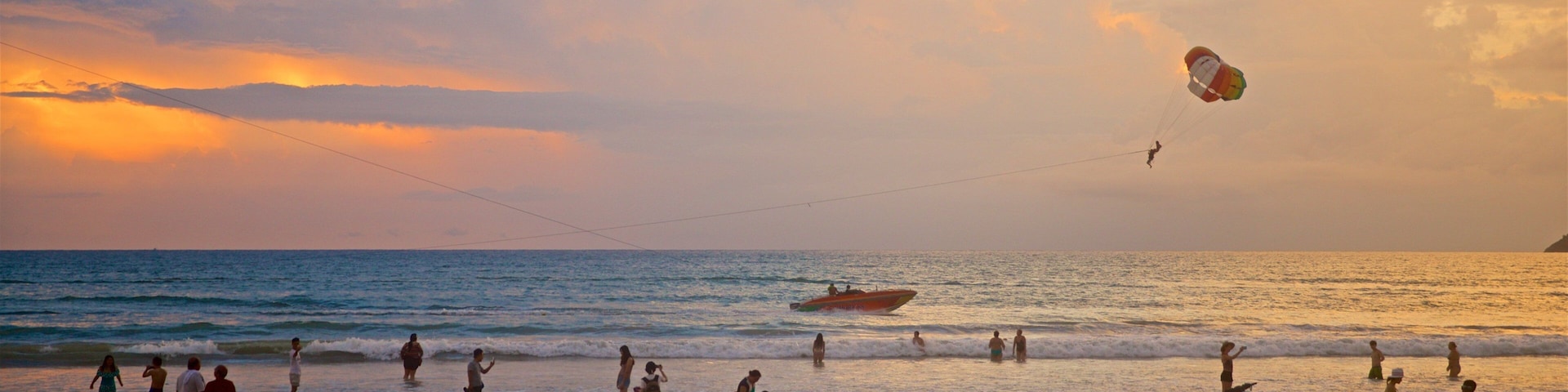 Patong showing a sunset, watersports and a beach