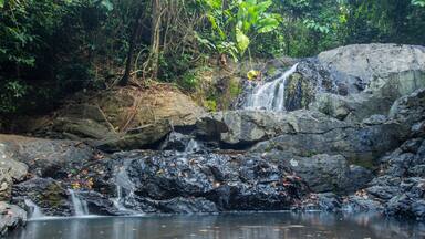 Ton Aow Yon Waterfall rich natural resources,in the forest,asia tropical areaat Island Phuket Thailand.