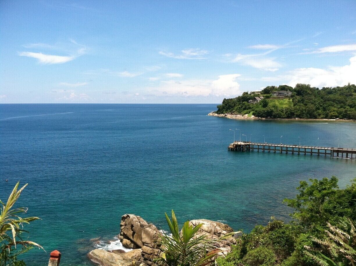 Scenic viewpoint while driving along the coast in Phuket, Thailand. While you may want to spend all of your days sunning on the beach, take at least one day to rent a motorbike and explore the island. You will come across a number of spectacular viewpoints!