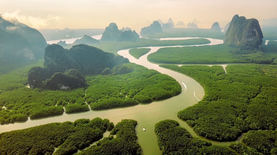Canal Nai Hgop and Ko Tapu Pier Islands in Phang nga Bay. Known originally and locally as Ko Tapu or Nail Island Departure from Ao Por Pier to Phang nga Bay on Cruiser Boat. Unseen Thailand.