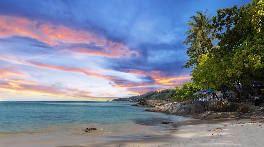 Patong Beach Phuket Thailand nice white sandy beach clear blue and turquoise waters and lovely blue skies with Palms tree sunset sunrise
