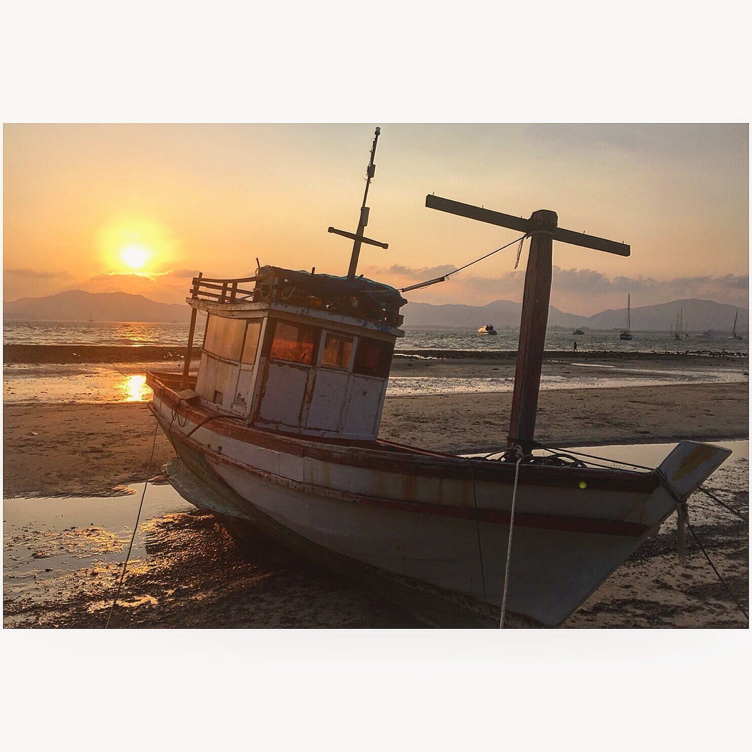A fishing vessel early in the morning sunrise