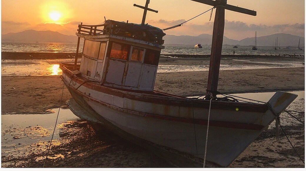 A fishing vessel early in the morning sunrise