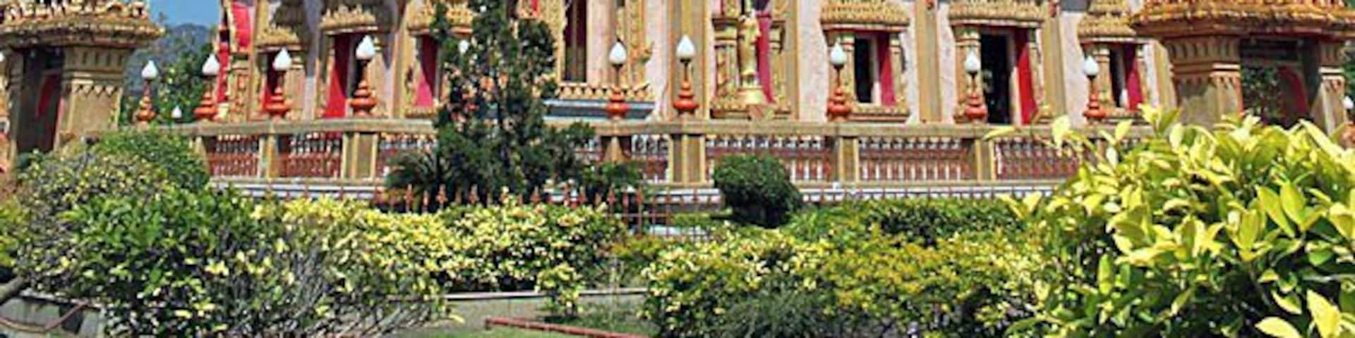 Not far from Phuket Town is the stunning Wat Chalong. Weâve visited a lot of wats in South East Asia, and this one certainly had its own unique flare.
The Grand Pagoda dominates the temple groundsâitâs cool and breezy location makes it just as popular as the splinter of Buddhaâs bone that rests inside. The pagoda walls depict Buddhaâs life story and immense golden statues of the various Buddha poses sit in the main hall. Choose the one you wish to worship to most.
Pay attention to the fire crackers going off inside the brick oven out the front of the ordination hall. Thai people set them off to celebrate if they receive any good luck.
