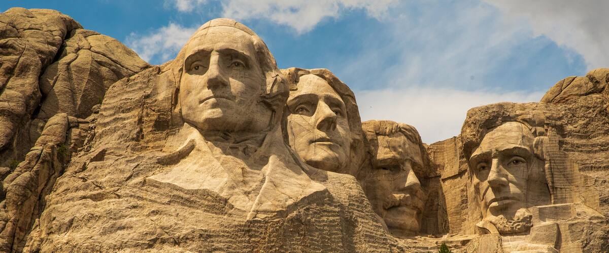 Mount Rushmore National Memorial with four presidential faces carved into the granite.