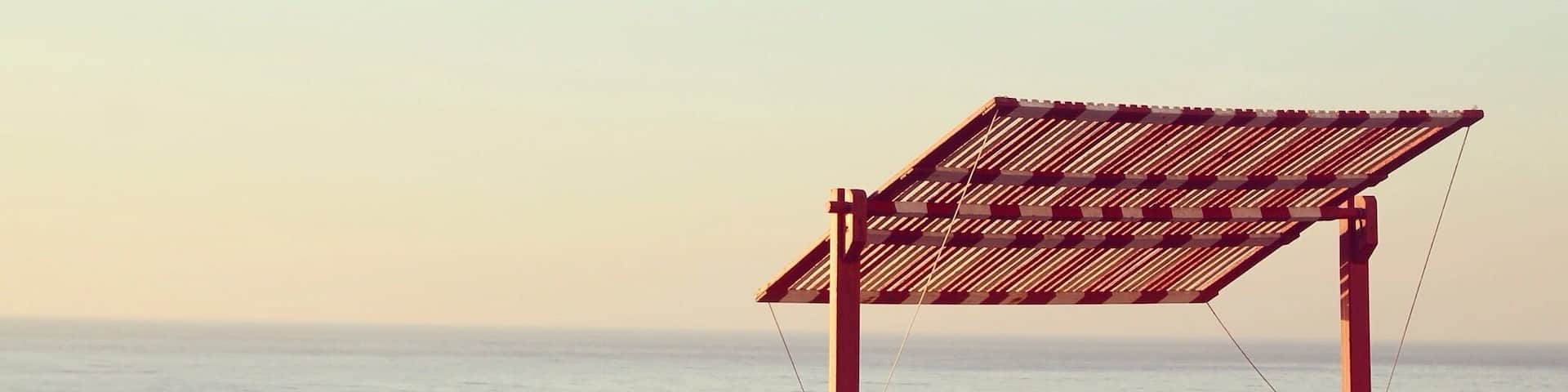 Santa Cruz is a beautiful Beach spot. You can find several red benches with red sunshades along the coast, that invite you to take a seat and enjoy the seaview.