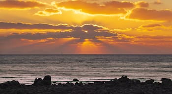Winter and sunset view of seaside rock against sea horizon at Seonnyeobawi Beach of Eulwang-ri near Yongyu Island of Jung-gu, Incheon, South Korea