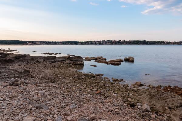 Scenic morning view at sunrise of picturesque coastal town Dajla seen from Karigador, Istria peninsula, Croatia. Village is nestled along the waterfront of Adriatic Mediterranean sea. Summer vacation
