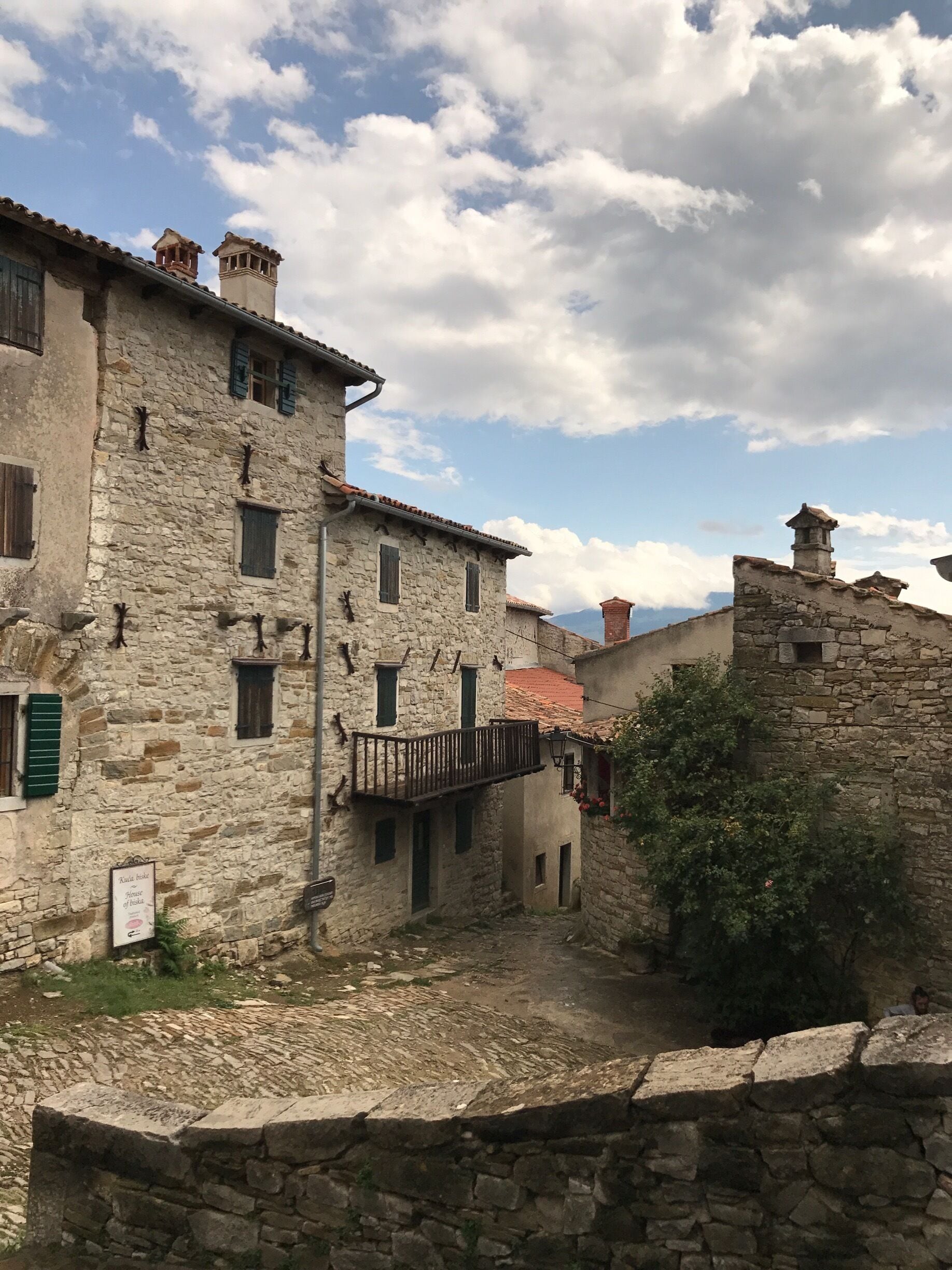 With a population variously quoted at 17, 18 and 23, the tiny medieval travel wonder of Hum on the Istrian peninsula in western Croatia is officially listed by the Guinness Book of Records as the smallest town in the world. Such a moniker swells this village of little more than a dozen grey stone houses with hundreds of visitors in the summer months. Getting here is somewhat challenging but well worth the stop. On a small road going to Hum, you will also find ruins. 