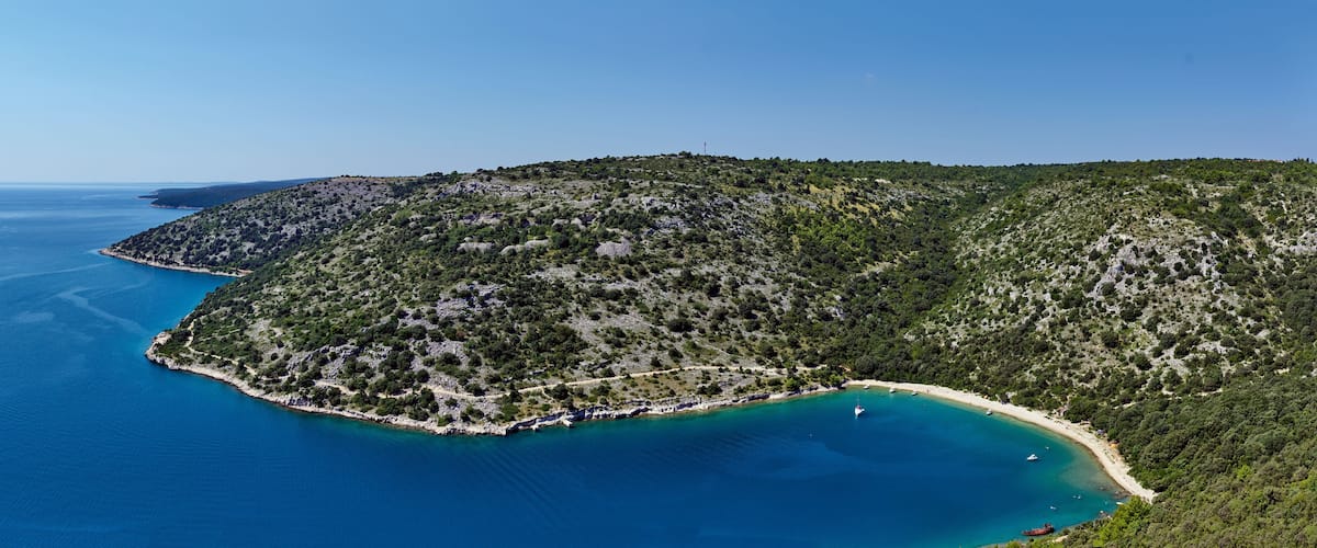 Aerial view of idyllic beach and clear blue sea, Rakalj, Istria, Croatia.