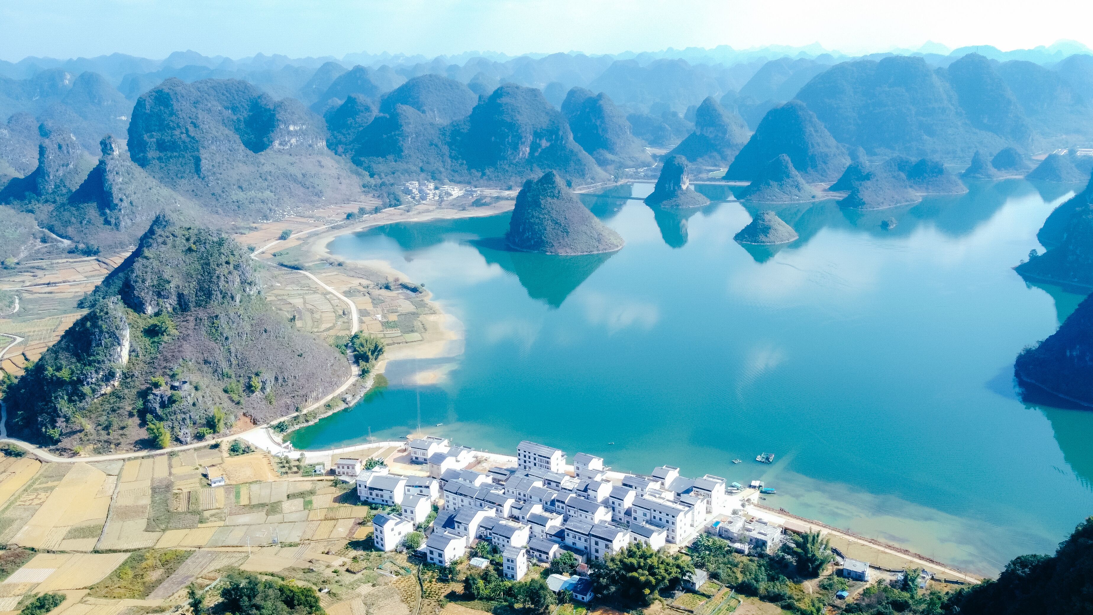 Drone view of Quyang Lake (Quyanghu)  karst peaks landscape reflection in water in Baise city, Guangxi province, China