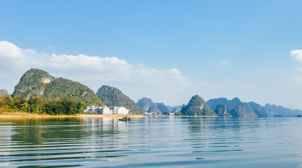 Quyang Lake (Quyanghu) karst peaks landscape reflection in water in Baise city, Guangxi province, China