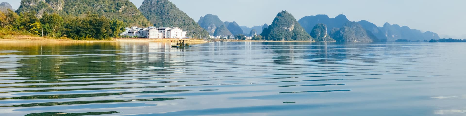Quyang Lake (Quyanghu) karst peaks landscape reflection in water in Baise city, Guangxi province, China