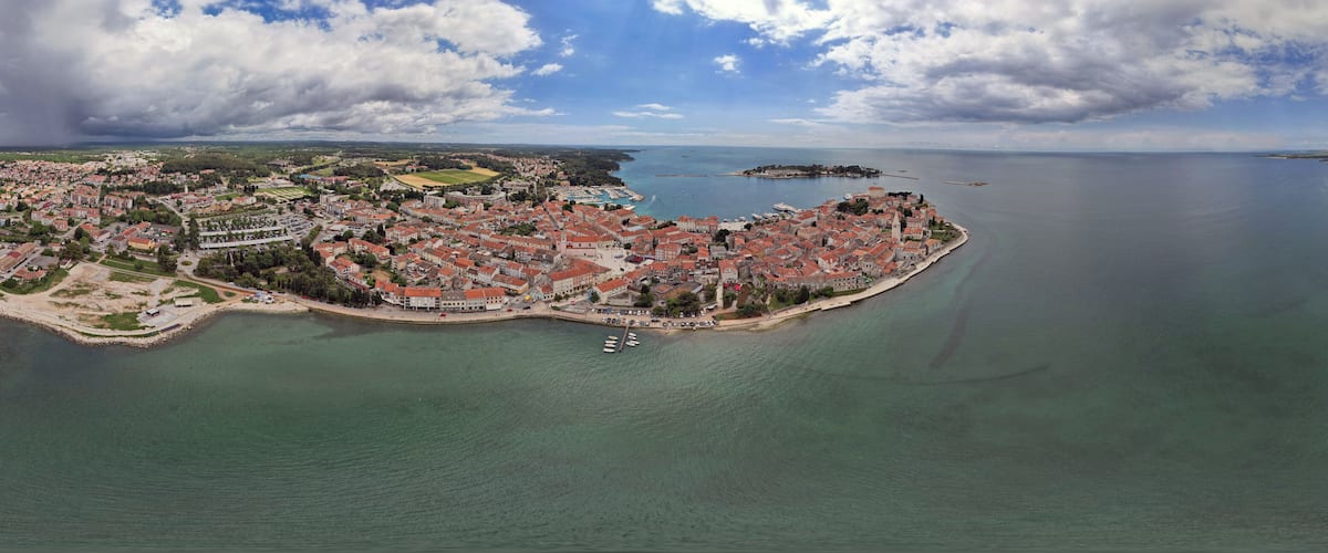 Aerial panorama of Porec harbor and old town, Croatia.