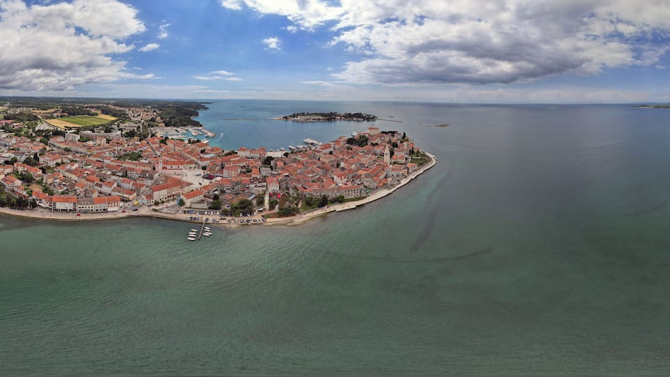 Aerial panorama of Porec harbor and old town, Croatia.