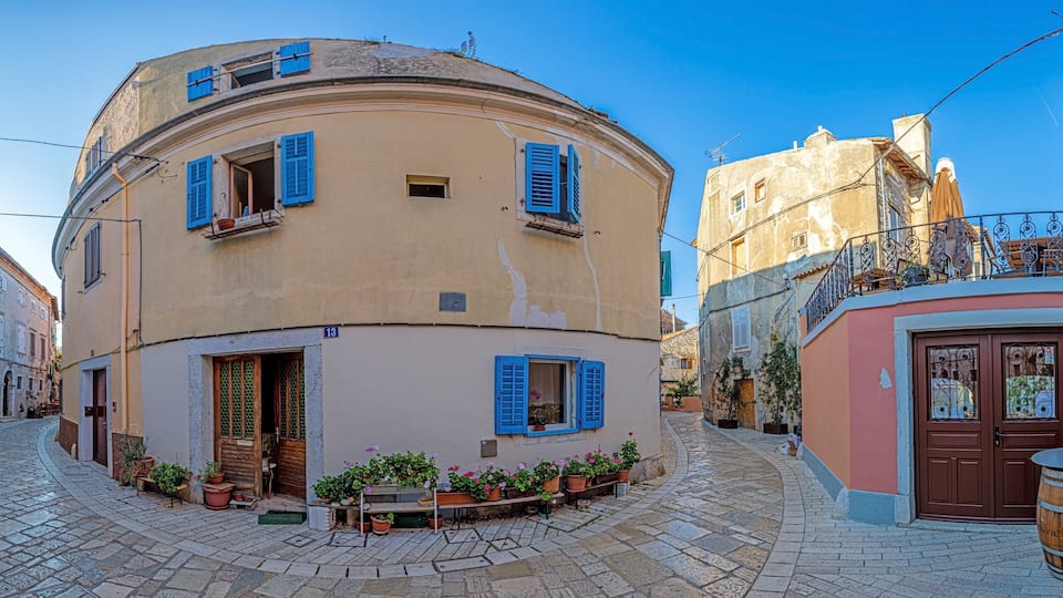 Image of the historical center of the Croatian coastal town of Porec in the morning light during the sunrise