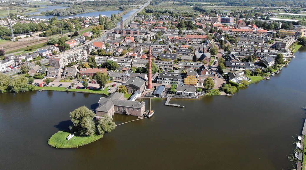 Aerial of historic steam pump station with pipe in Halfweg, the Netherlands