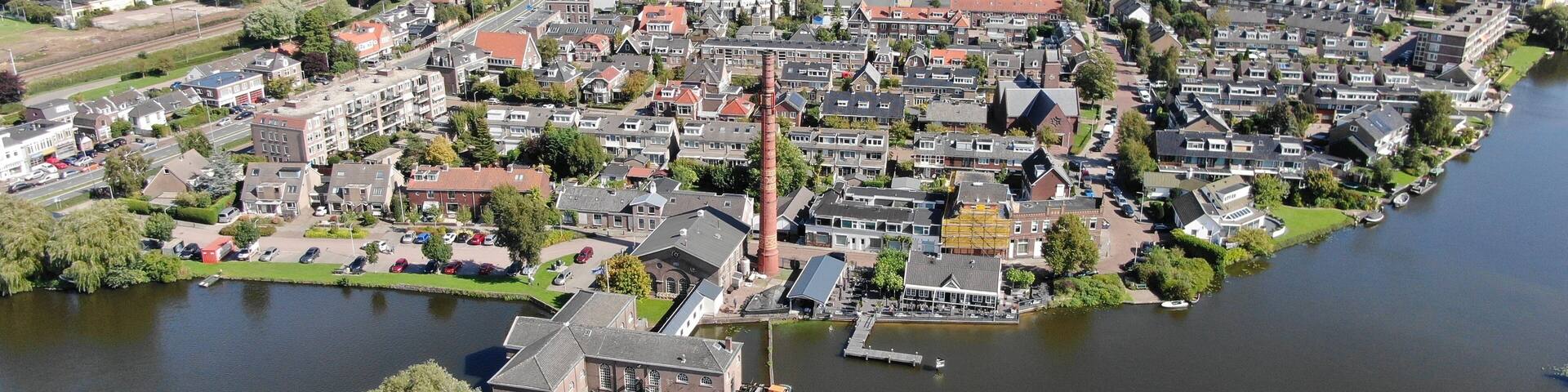Aerial of historic steam pump station with pipe in Halfweg, the Netherlands