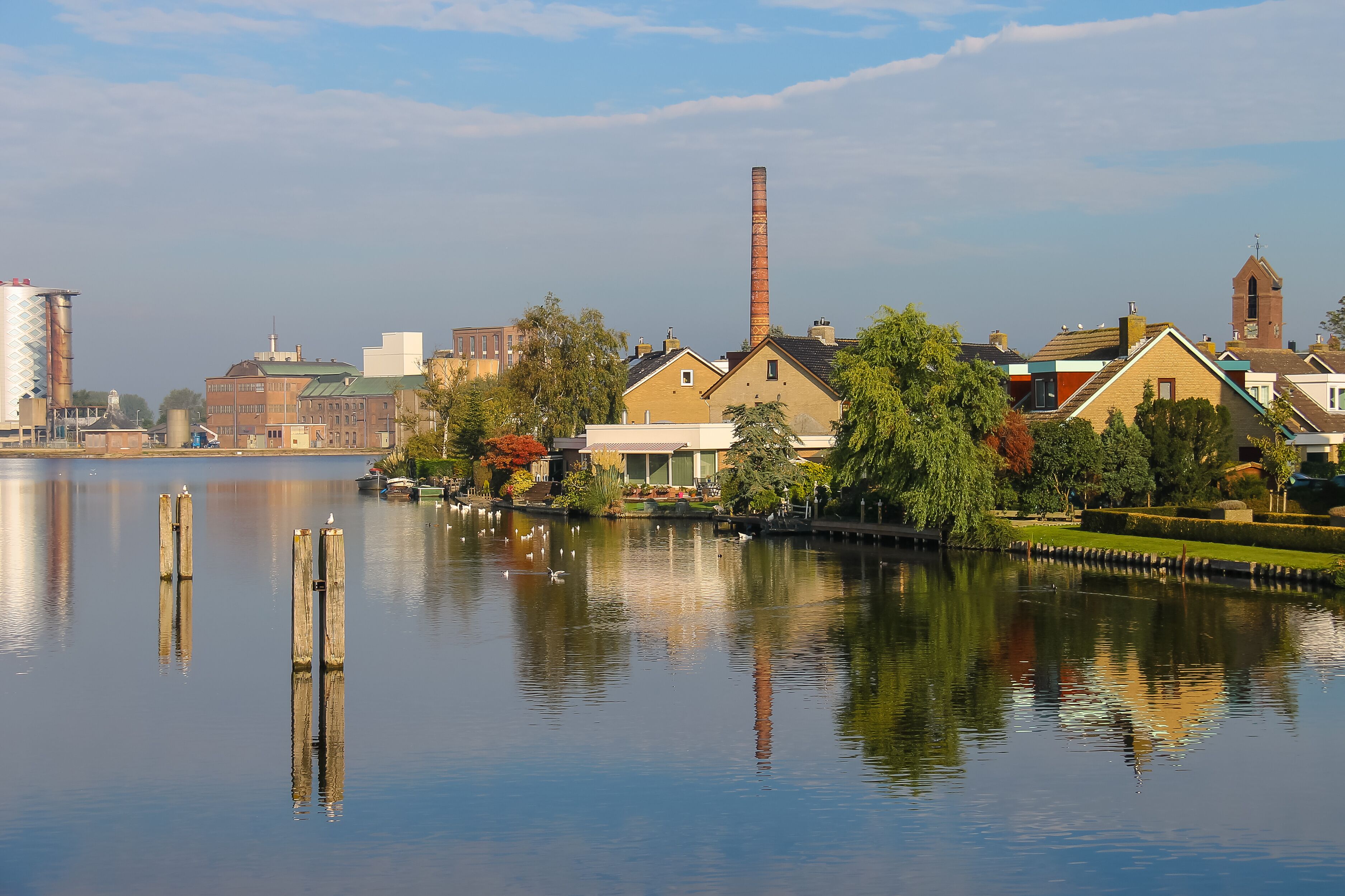 View of Halfweg from Zwanenburg through the canal Ringvaart, the