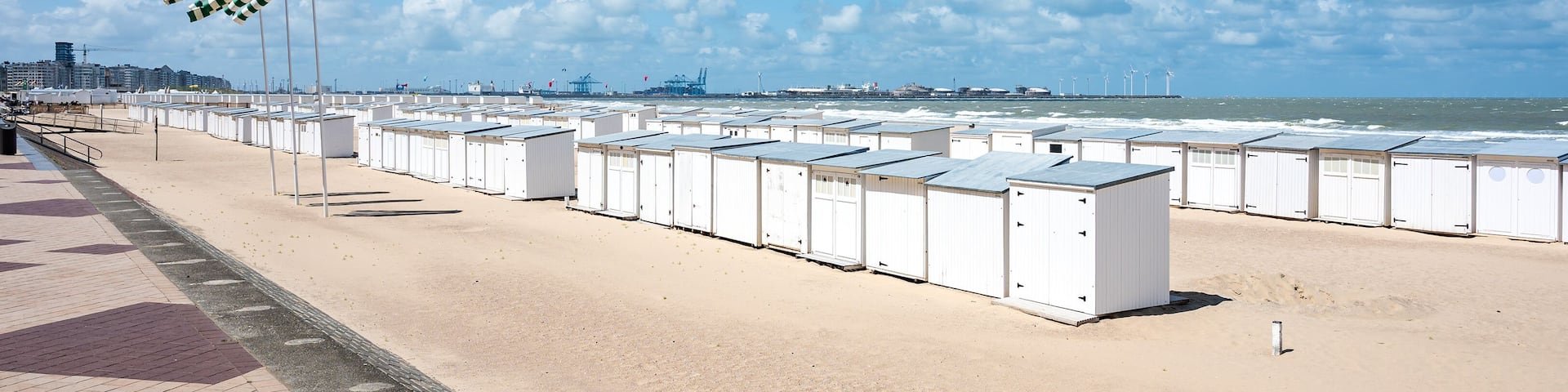 White beach cabines at the Albert beach in Knokke Heist, West Flanders, Belgium