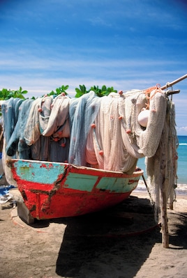 Fishing net hanging on boat at Anse La Raye in St. Lucia, Caribbean