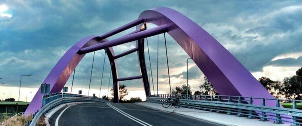 A purple bridge with a curved arch design.