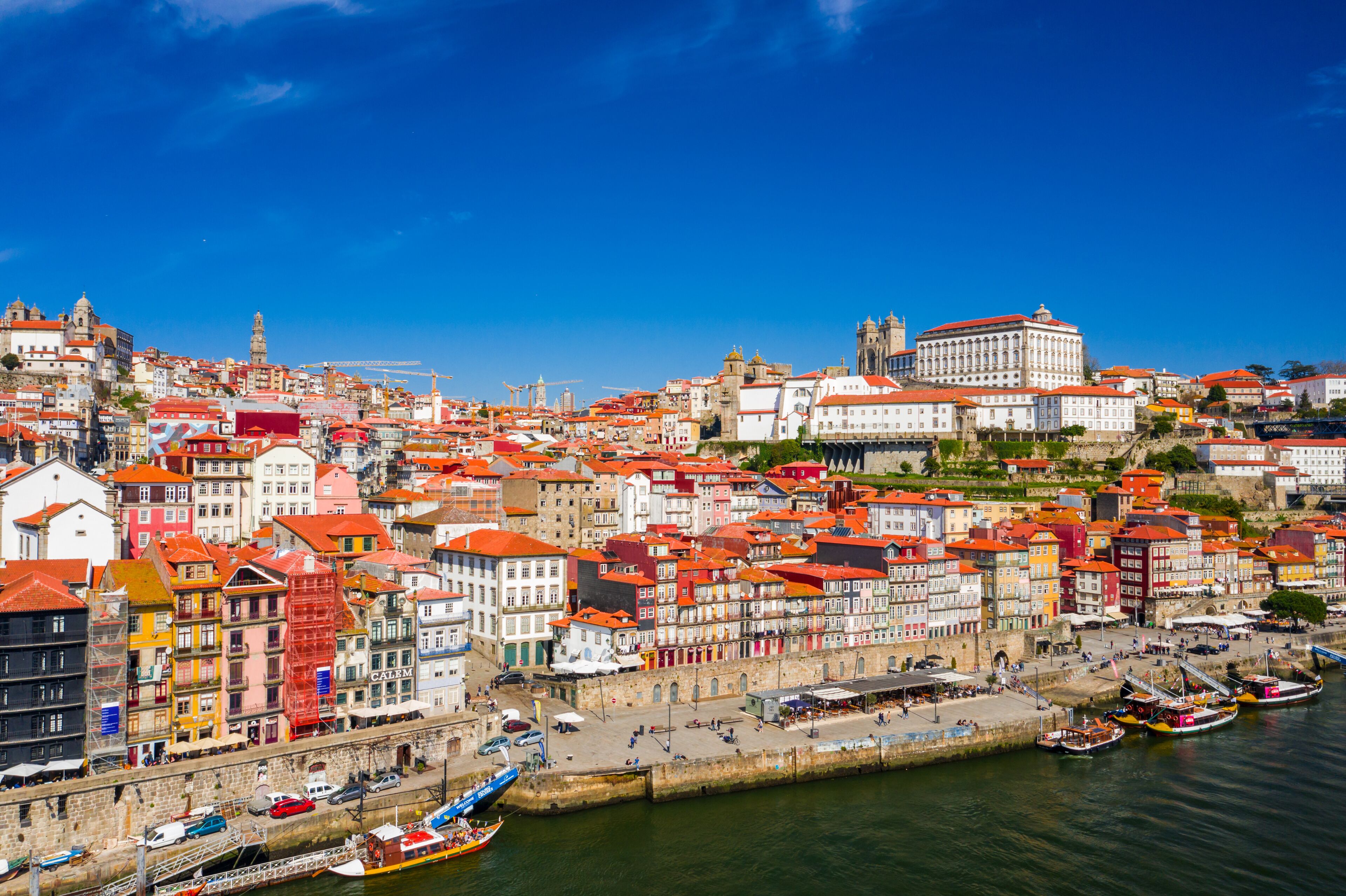 Porto Cityscape with Dom Luis I Bridge over Douro River and medieval Ribeira district at day time, Portugal