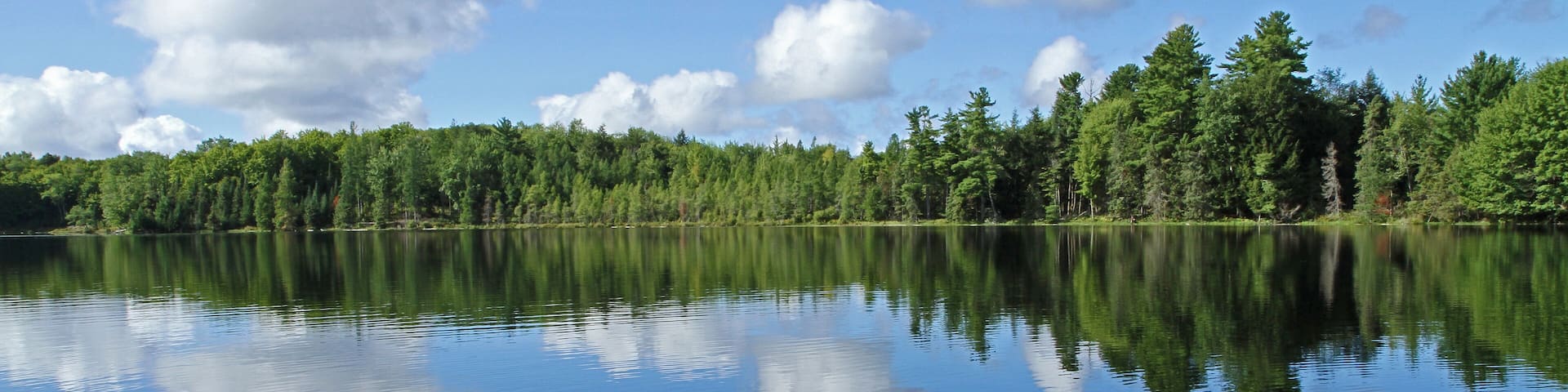 Puffy Clouds Reflected in Lake