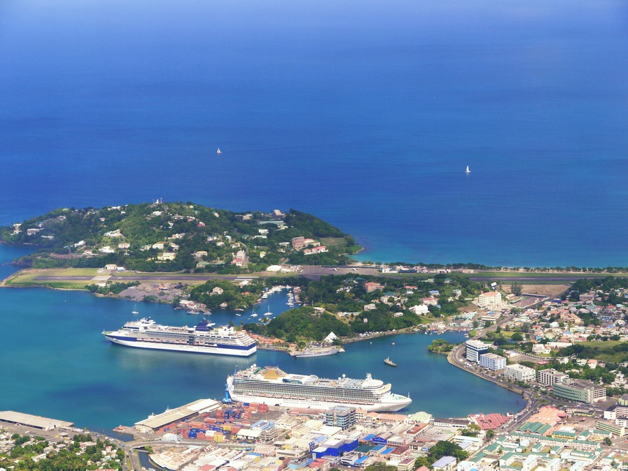 Aerial view of docks and airstrip with cruise ships and yatchs in bay at Pointe Seraphine, Castries, Saint Lucia
