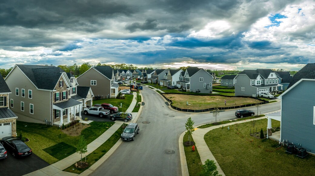 Aerial panorama of new construction luxury residential neighborhood street with American single family homes in Maryland USA real estate