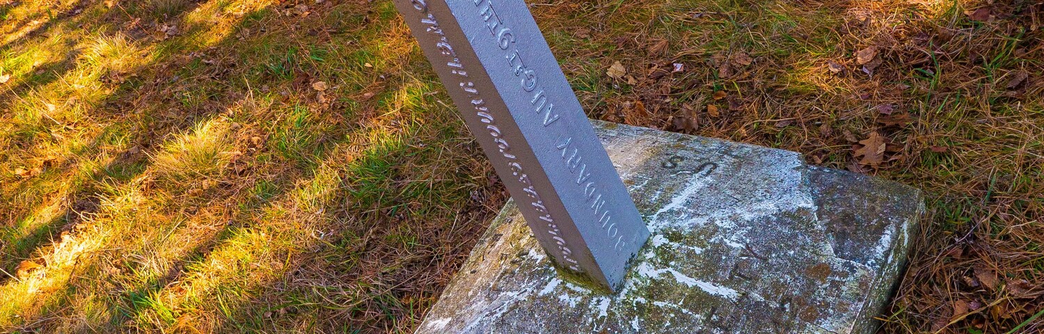 1842 Canada/USA border marker in the forest, stone and metal