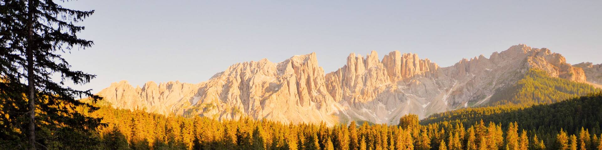 Carezza lake at sunset, dolomites, Italian alps
