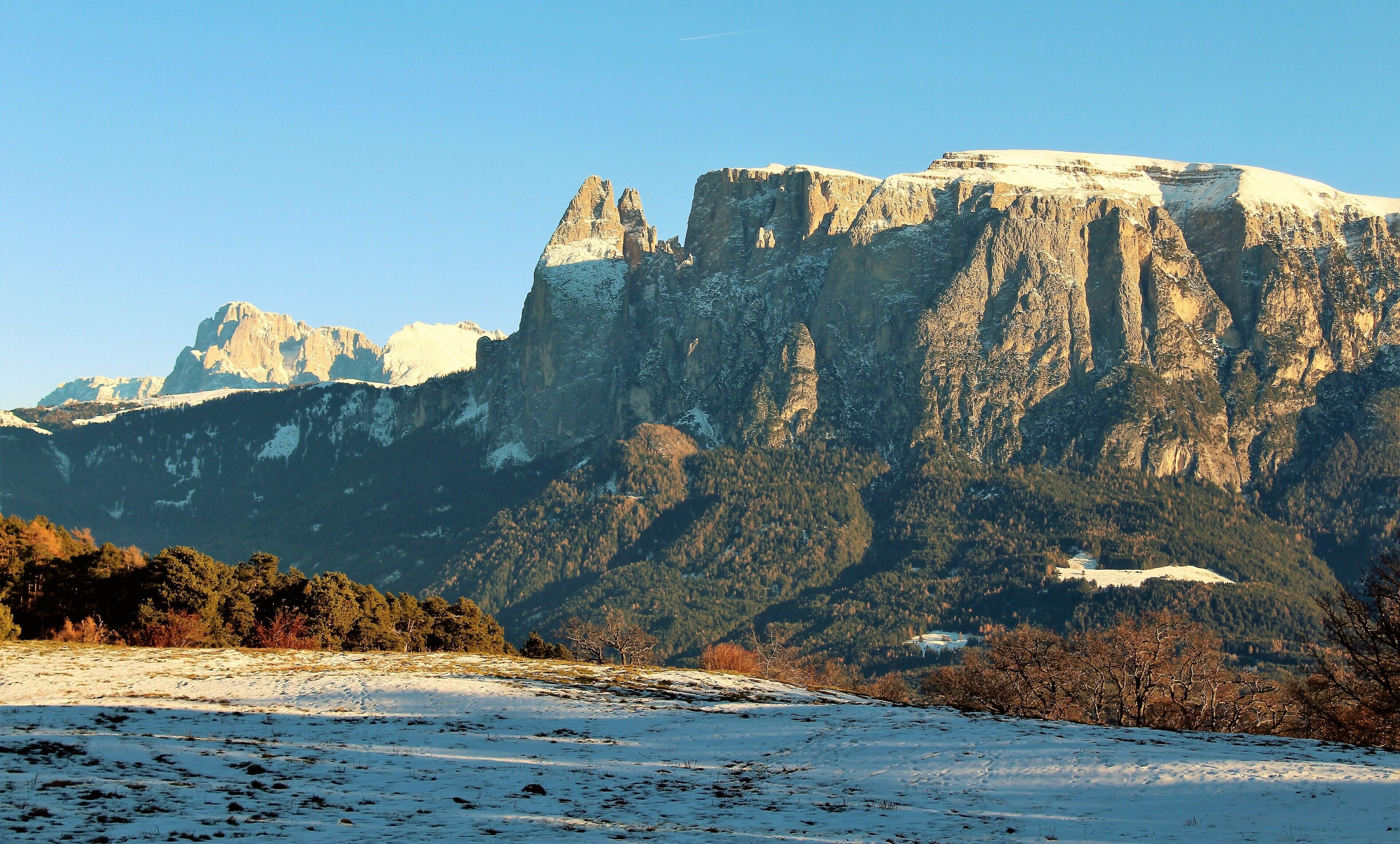 Schlern/Sciliar in the Dolomites! It's highest point is 2,563 m (8409 ft). And one of the most interesting mountains I've seen! My photo here was taken a little north of Bolzano/Bozen. No trip to the Dolomites is complete without visiting this! It's an iconic part of Northern Italy.