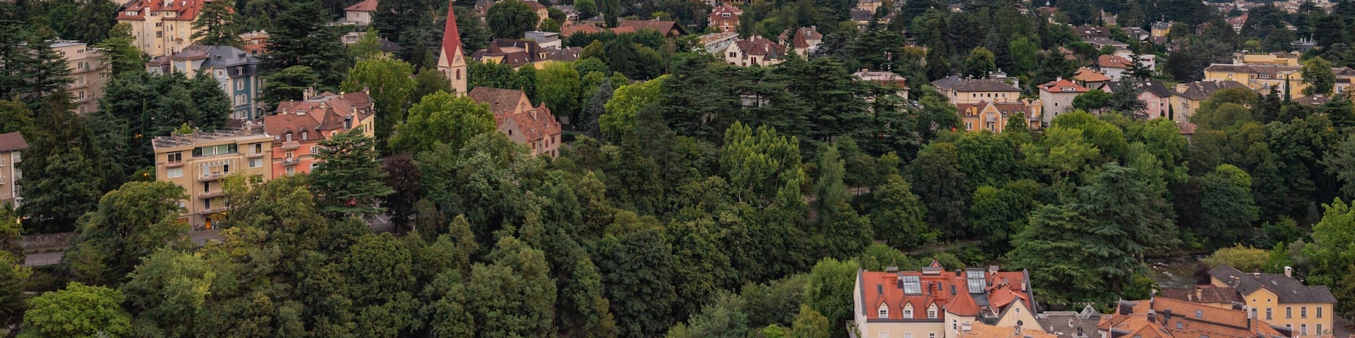 Merano featuring landscape views, a small town or village and a sunset