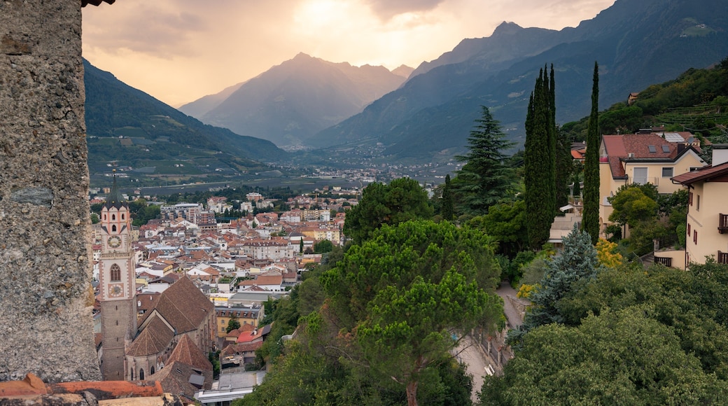 Merano Historic Center featuring a small town or village, a sunset and landscape views