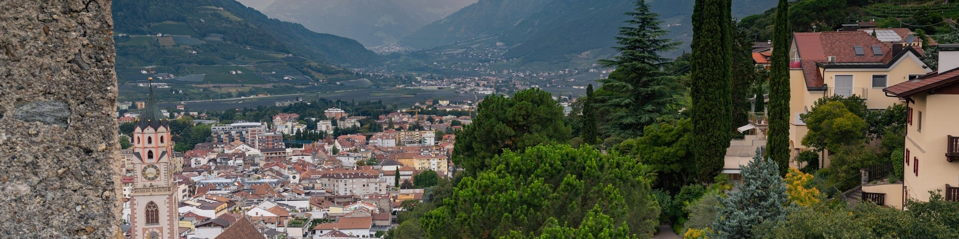 Merano Historic Center featuring a small town or village, a sunset and landscape views