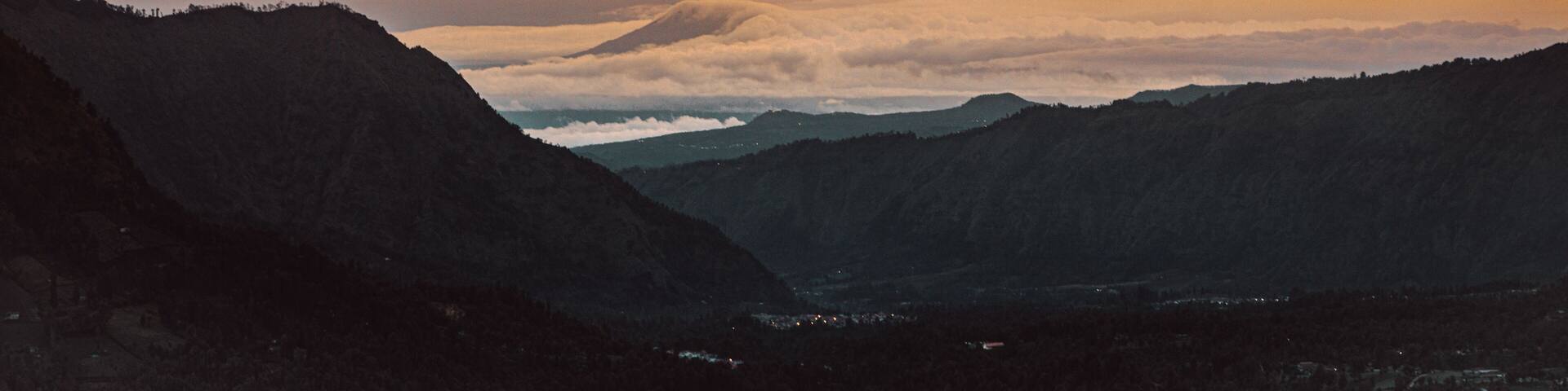 Bromo Tengger Semeru National Park in Indonesia, with calderas, mountains, and a colorful sky